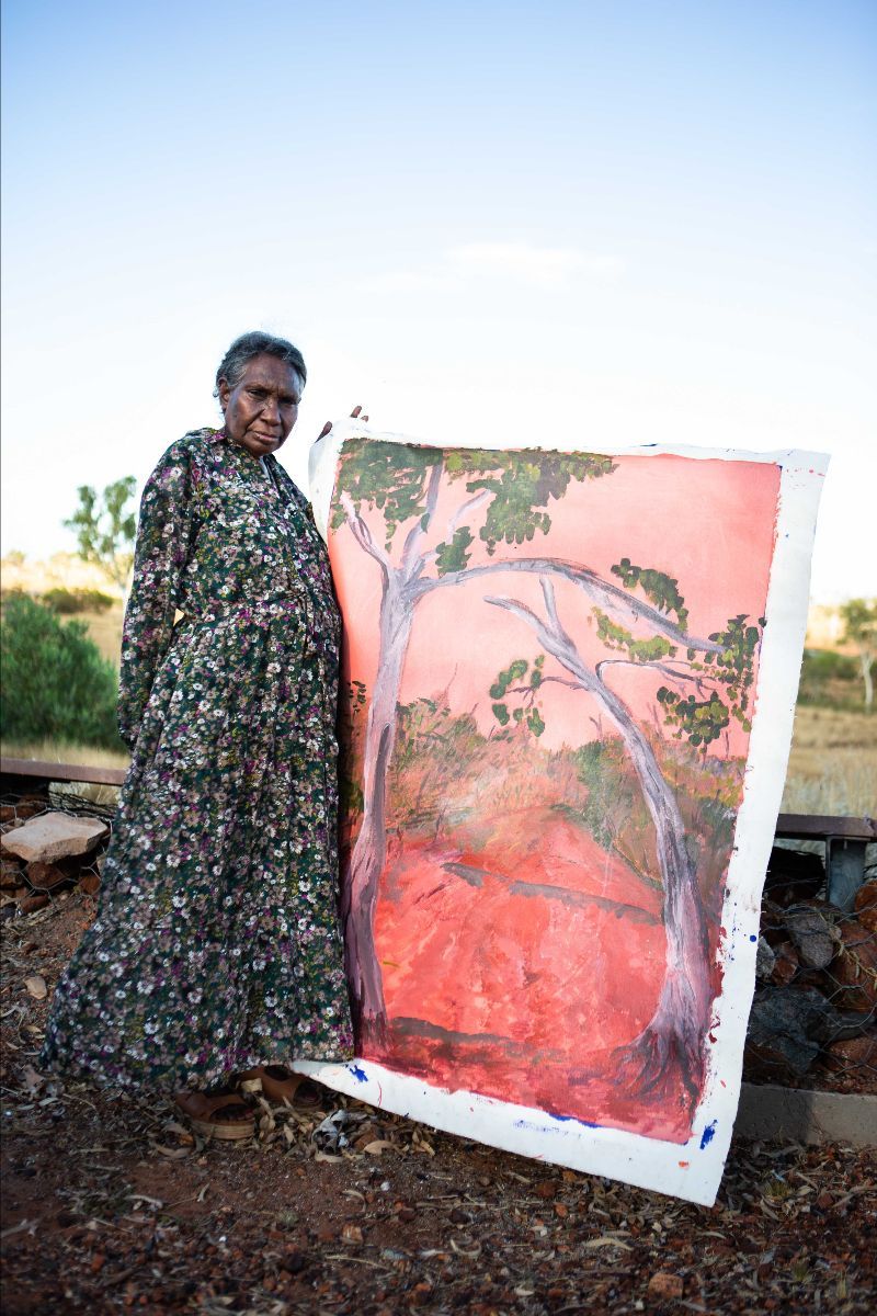 Wendy Hubert (Juluwarlu Art Group) with her artwork in Roebourne, 2020. Photography by Claire Martin