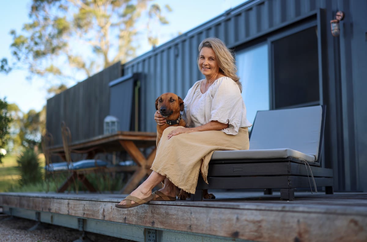 Two Rabbit Hill owner Jo Reid and her happy hound_two new cabins in the Scenic Rim_pic Peter Wallis