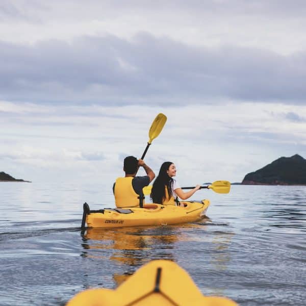 Couple enjoying a day of kayaking along the Karuah River off Jimmys Beach, Hawks Nest (Destination NSW)